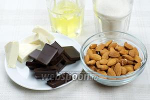 Для приготовления печенья необходимо взять 3 белка, миндаль, сахар, чёрный шоколад и мягкий сыр сливочного вкуса.
