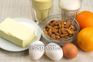 Для приготовления кекса возьмём кукурузную муку, яйца, сахар, миндаль, размягчённое сливочное масло, крупный апельсин и щепотку соли.