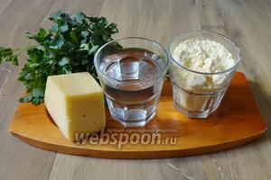Для приготовления таких лепёшек из кукурузной каши понадобится кукурузная мука, тёплая кипячёная вода, зелень петрушки, сыр, оливковое масло, соль по вкусу.