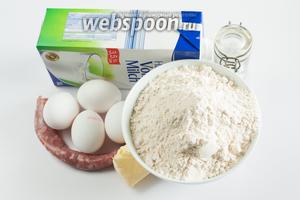 Соотношение продуктов следующее: на 1 литр молока берём 20 столовых ложек муки, 4 куриных яйца, солидное количество соли — где-то 1 столовая ложка без верха. Масло (количество и сортность) — какое под руку попадётся, а можно обойтись и вовсе без него. В рецепте Париде используется очень небольшое количество колбасы — примерно 100 грамм. Это объясняется, во-первых, тем, он был немного скуповат. Но есть и функциональная причина: когда он готовил для себя одного, он съедал верхний слой с колбасой на ужин, а нижний оставался на следующий день на обед, и употреблялся в качестве гарнира к мясу. Так вот, если едоков достаточно, чтобы срубать шмакафан сразу, то лучше взять на такое количество всё же 200 грамм колбасы (а ещё лучше — 400, и делать по другому рецепту, который я покажу как-нибудь в другой раз). ;) В идеале используется домашняя колбаса, либо ещё сырая, либо слегка подкопченная.
