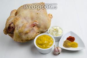 Чтобы приготовить праздничное блюдо из курицы, нужно взять тушку целой курицы; для соуса взять горчицу, майонез, чеснок, паприку, кориандр, карри, соль.